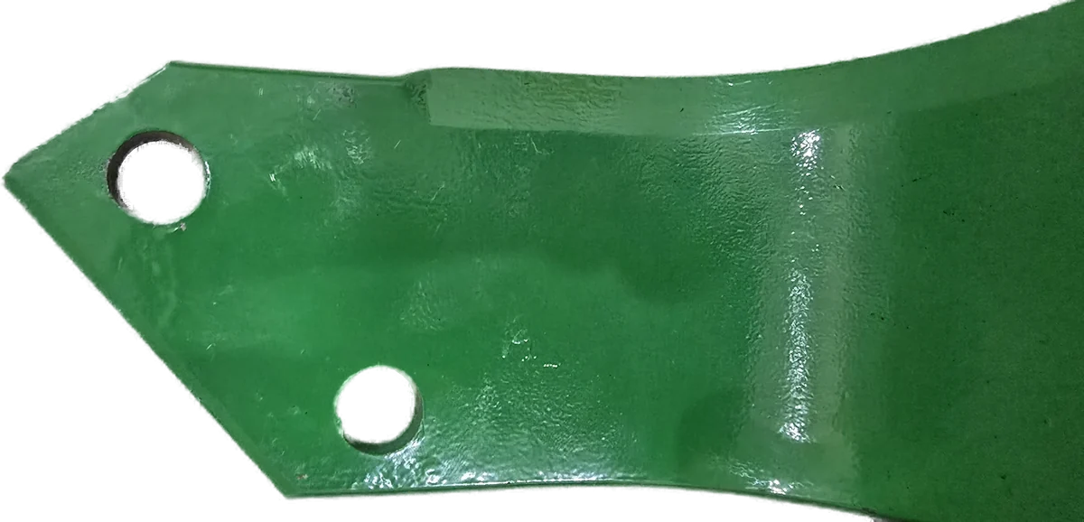 Close-up of an OSCAR blade: bolt holes and painted finish